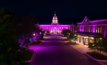 Purple lights illuminating Buncombe County buildings representing Code Purple for homeless shelters.