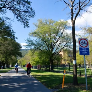 Biking path in Asheville with cyclists and safety signs