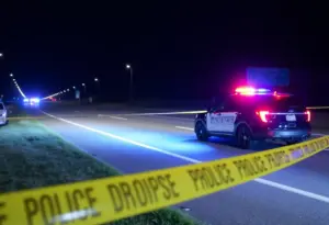Night-time investigation scene on a highway with police lights